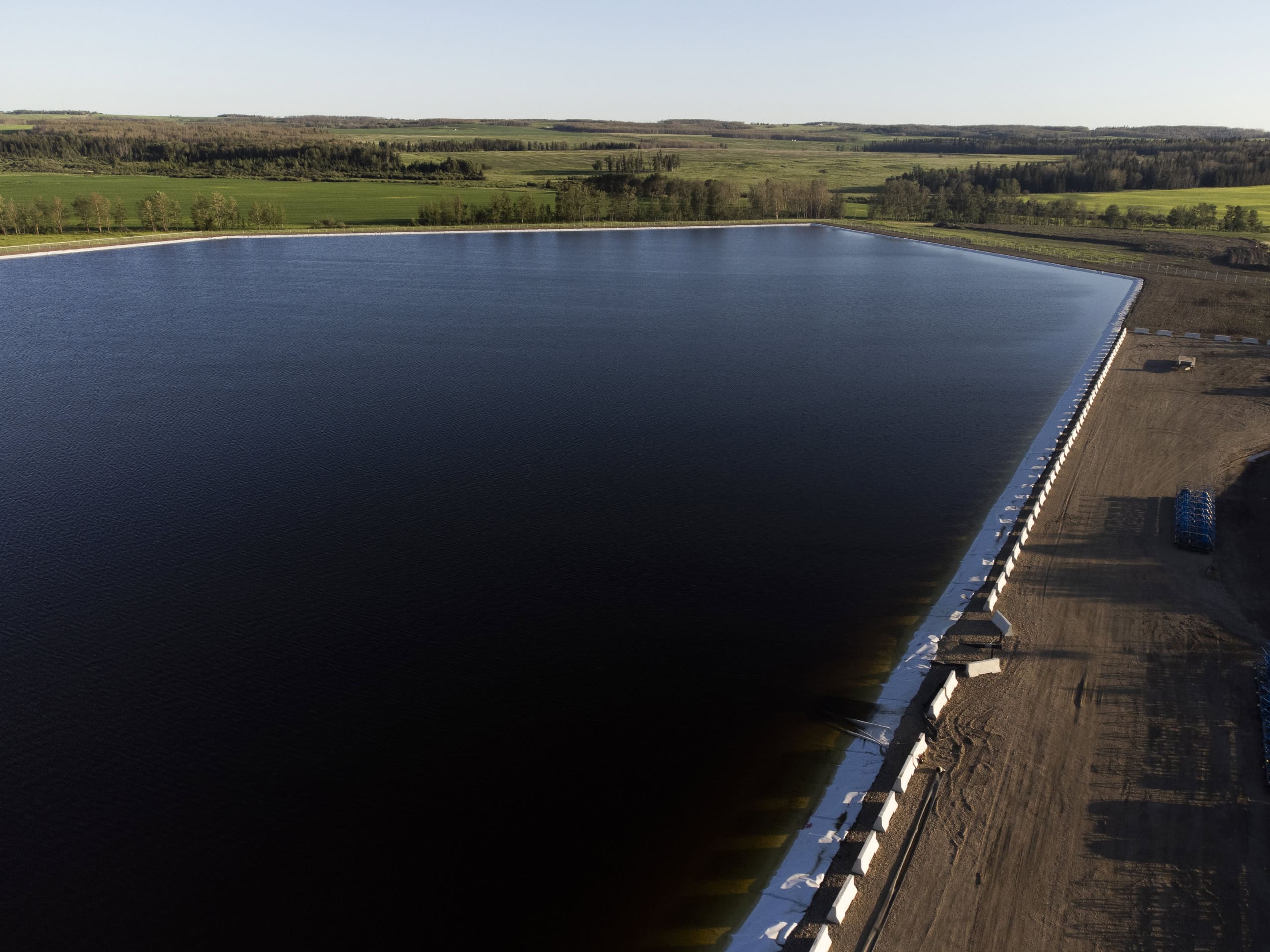 A large reservoir of water, set into green fields.
