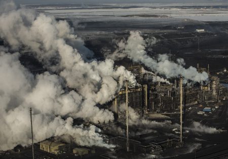 Emissions rise from a sprawling industrial site