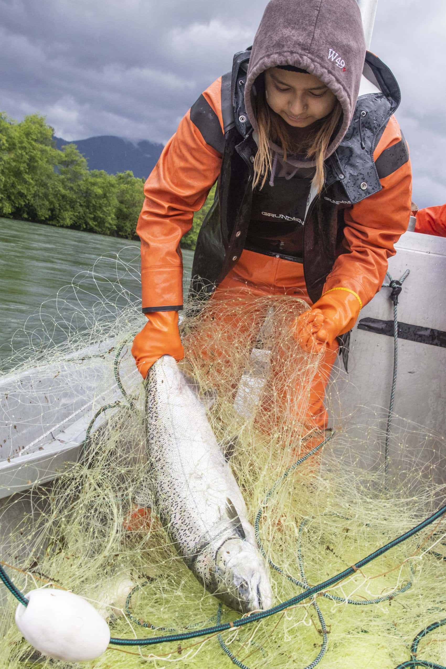 Janelle Schuyler with a freshly caught Chinook salmon on the Skagit River.