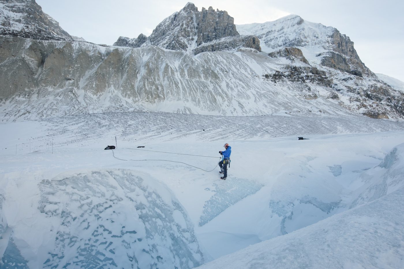 A mountain guide charts a path down the Athabasca Glacier in Jasper National Park.