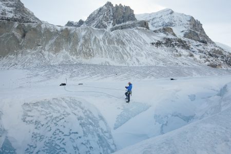 A mountain guide charts a path down the Athabasca Glacier in Jasper National Park.