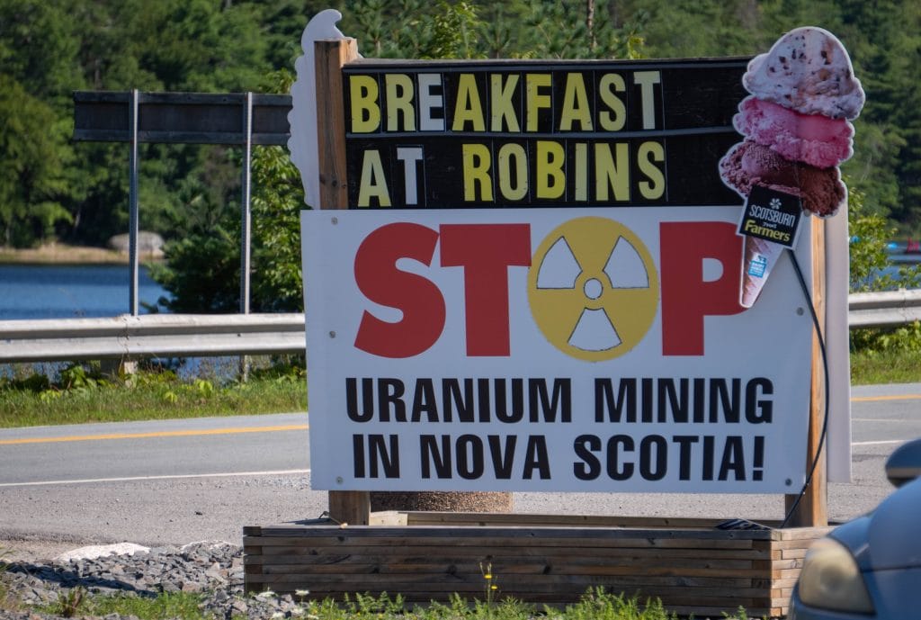 A roadside sign reads, “Stop Uranium Mining in Nova Scotia!”