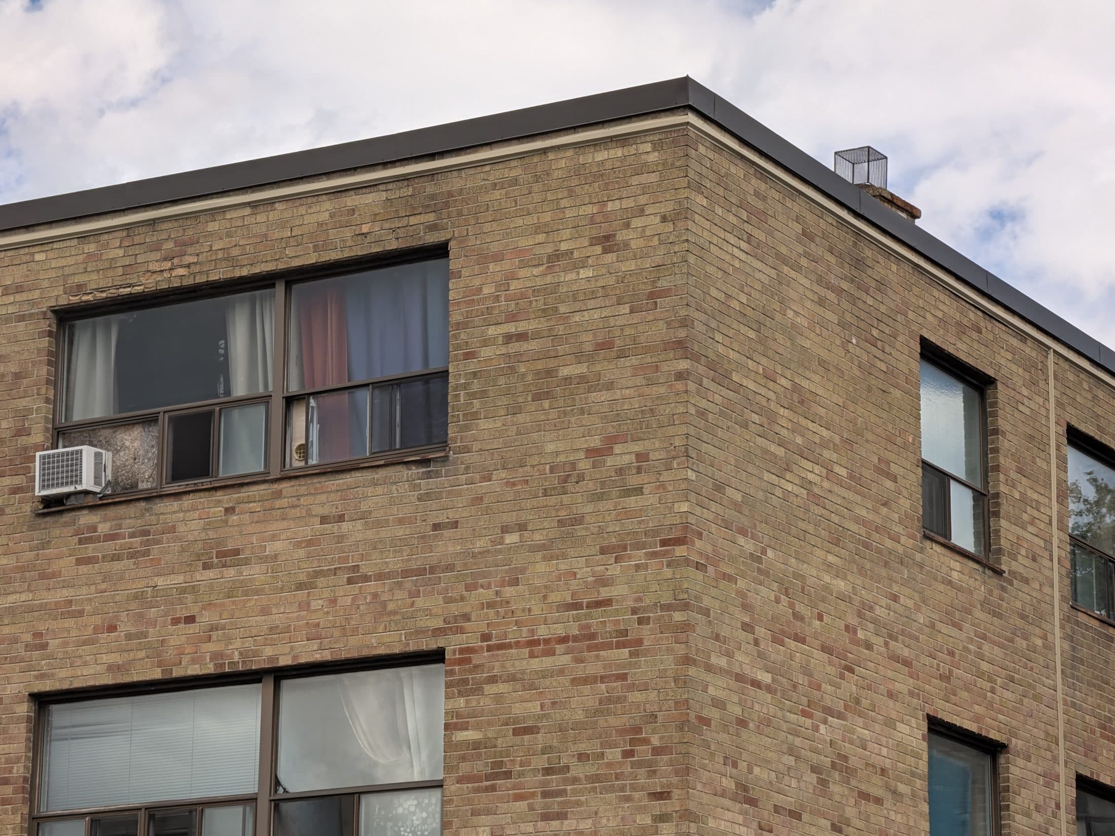 A close up of a building without central air conditioning