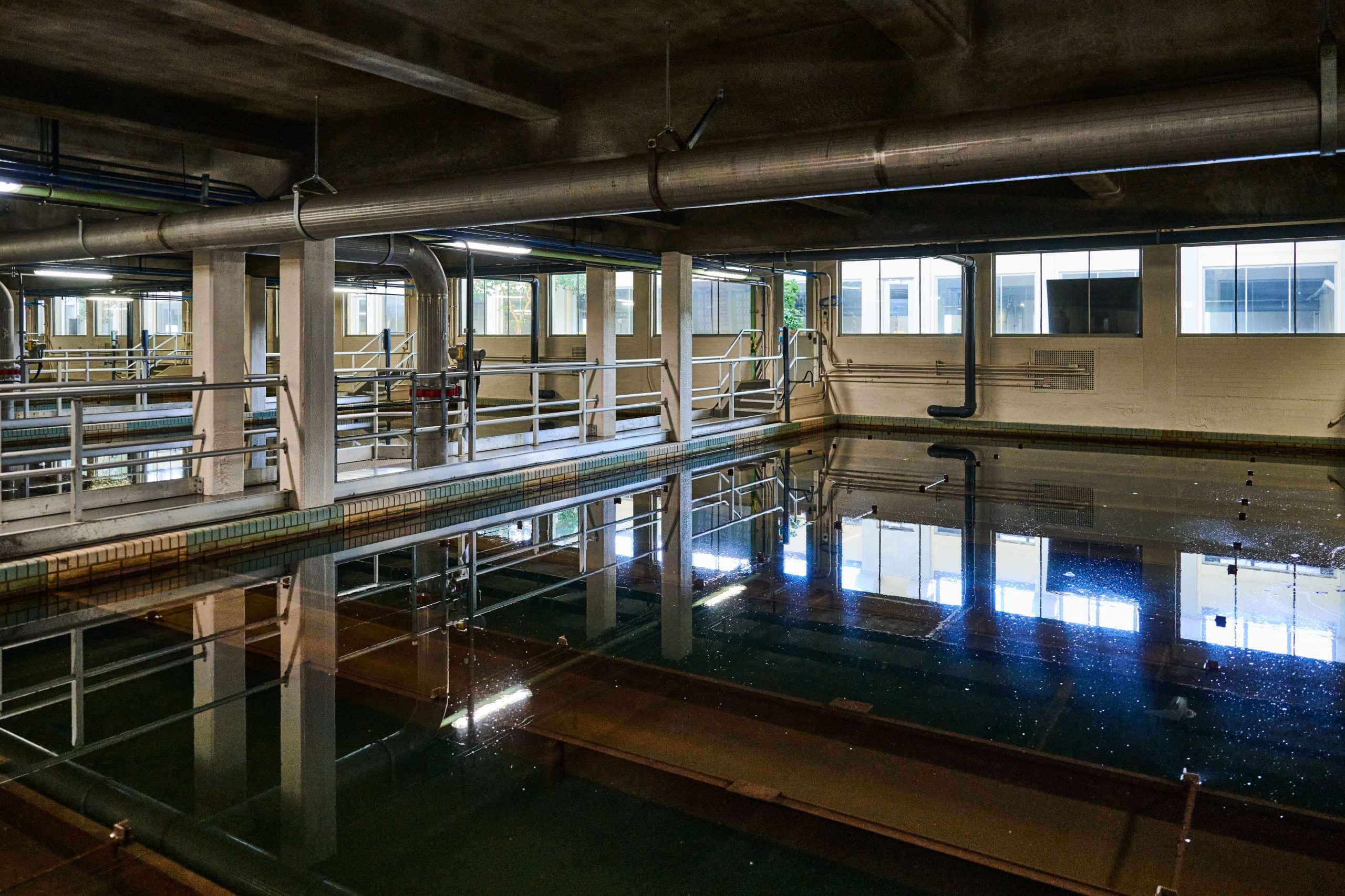 Cavernous room with a large water tank.